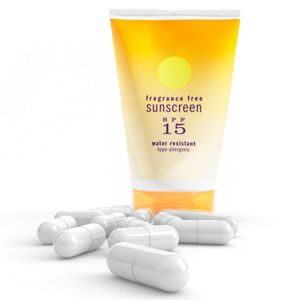 Sunscreen bottle and white capsules.