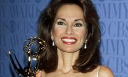 One of only two actors who have remained All My Children for its entire run, Susan Lucci, with her 1999 Daytime Emmy.