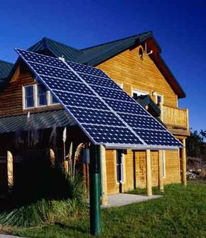 Sustainable communities design their houses to be energy efficient, like this house with solar panels.