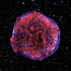 This is the remnant of the supernova Tycho Brahe observed in 1572. The image is a colorized composite of low-energy x-rays (red) showing debris and high-energy x-rays (blue) showing the blast wave, plus the visible field of stars around it.