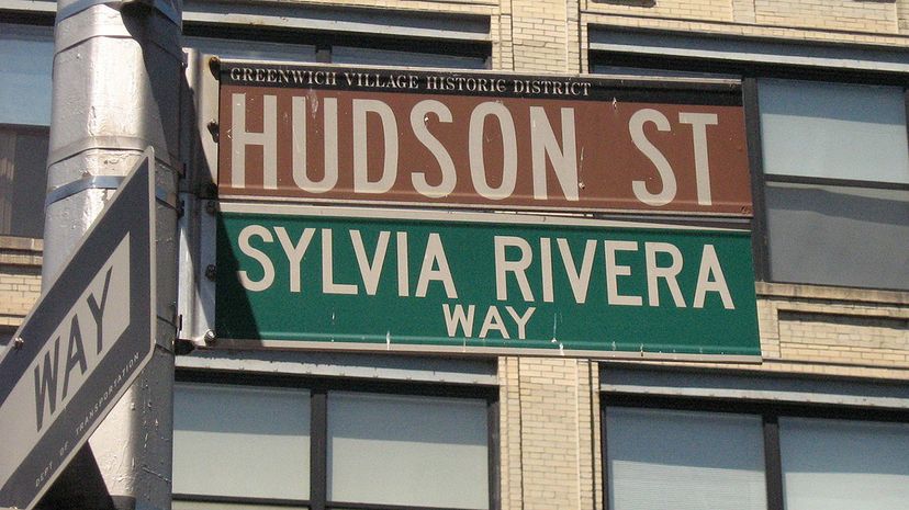 street signs of Hudson Street and Sylvia Rivera Way