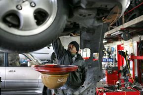 Mechanic changing oil