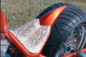 The Sabre Tooth's exotic snakeskin seat, a typicalfeature of Precious Metal Customs choppers.