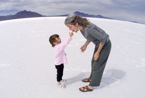Shannon Loitz gives her mother, Cheryl, a taste from the Bonneville Salt Flats in Utah.