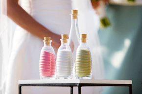 A sand ceremony offers a symbolic, visually poignant moment that can help personalize a wedding.