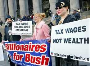 Members of Billionaires for Bush, a theatrical troup, mock the wealthy as they stand outside of the James A. Farley post office, where last-minute tax filing takes place.