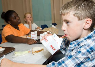 Children eating lunch in the school cafeteria.