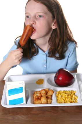 Student eating her school lunch.