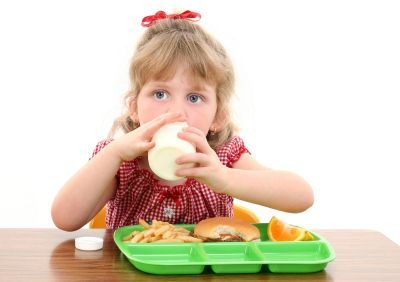Young girl having lunch at school