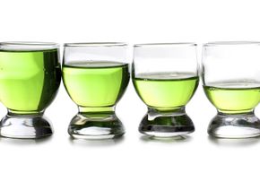 Glasses Filled with Green Liquid