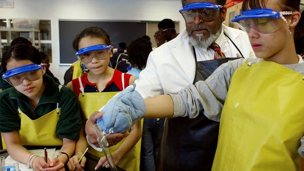 Men educating child through teamwork.