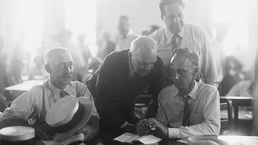 Dudley Field Malone, Garfield Hays, Thomas Scopes and John Scopes in the courtroom during the trial