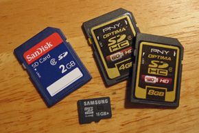SD cards come in a standard set of sizes and capacity formats, and from a variety of manufacturers. Shown here are a standard SD card, two SDHC cards and a microSDHC card.
