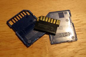 An SD card split open