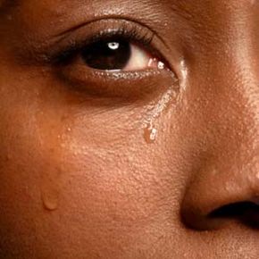 Close up of tear on womans face.