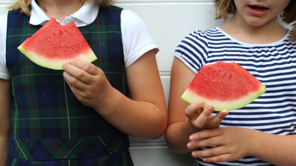 kids holding watermelon