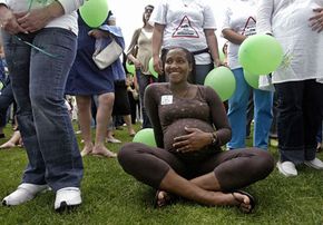 Pregnant women gather in a park in Oeiras, Portugal for an event to celebrate birth in July 2007. Some people believe that a full moon causes an increase in birthrates.