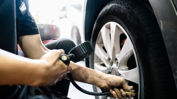 Man Checking Self-inflating Tire Pressure