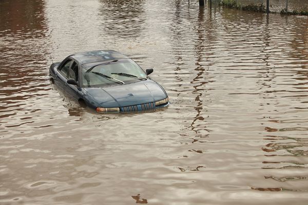 Car half submerged in water