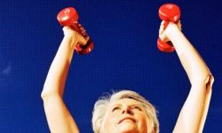 elderly woman holding dumbbells