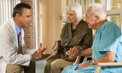 elderly couple with doctor