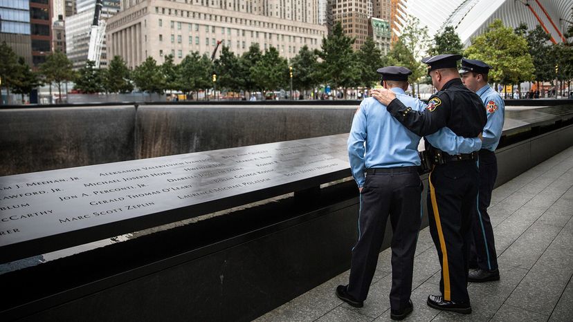 Men in police uniforms standing outdoors.