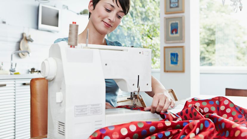 Woman sewing fabric on sewing machine