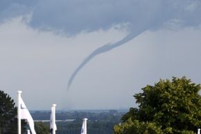 A waterspout touches down in the English Channel off the English coast on June 28, 2014.