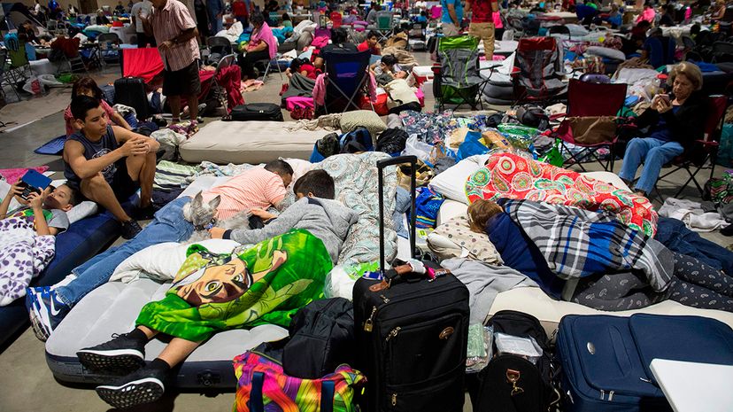 Hundreds shelter in place from Irma at the Miami-Dade County Fair Expo Center, which was converted into an emergency shelter, Sept. 8, 2017. Florida Gov. Rick Scott warned the state's 20 million residents should be prepared to evacuate to a safe location. SAUL LOEB/AFP/Getty Images