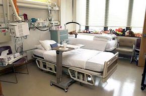 At Shepherd Center, patients with paralysis in their arms and hands can still operate TVs, telephones and nurse-call buttons by sipping or puffing into a straw that controls the equipment. Ceiling lifts also help nurses and therapists easily transfer a patient from wheelchair to bed or from bed to wheelchair.