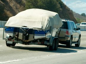 An SUV towing a boat