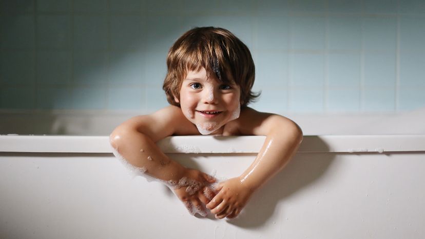 little boy in bathtub