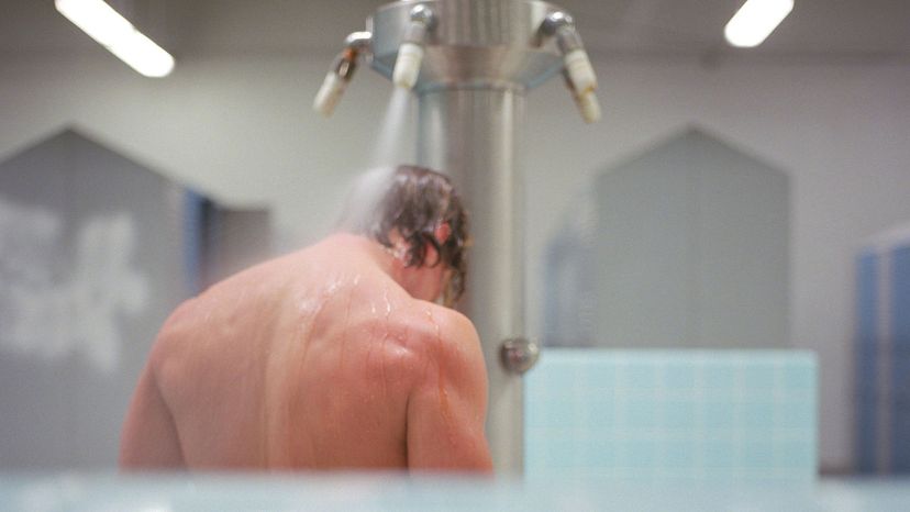 men in locker room shower