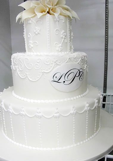 three-tiered white wedding cake
