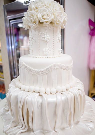 white wedding cake with fondant designs
