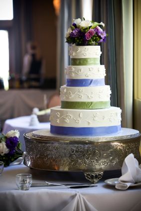 elegant springtime wedding cake on platform stand