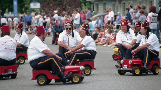 Why do Shriners drive those little cars?
