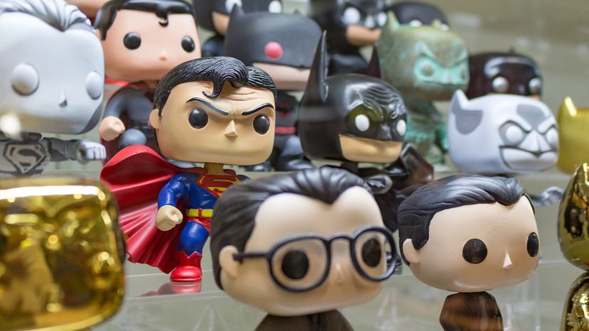 Rows of figures in a Superman and Batman Funko Pop collection