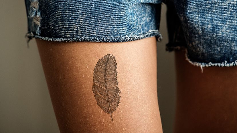 Upper thigh tattoo