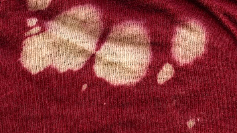 White spots on red cotton fabric
