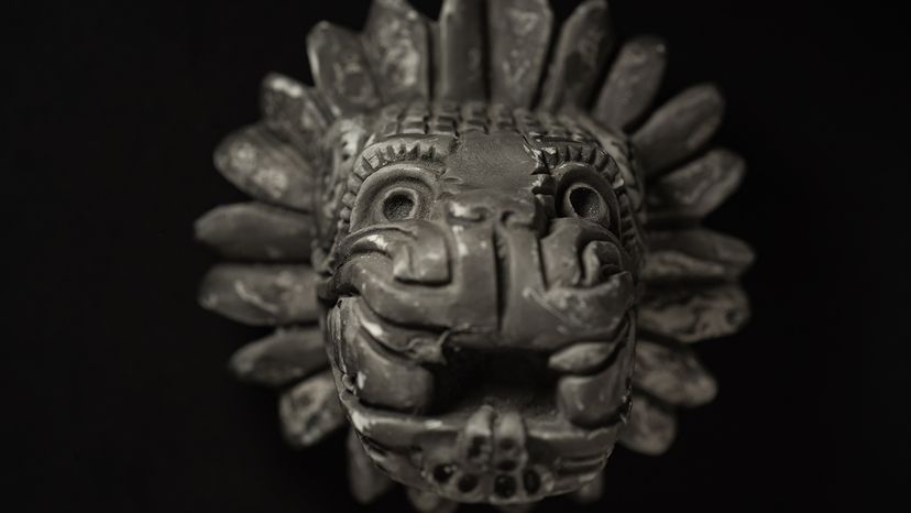 Macro close up photography of a Quetzalcoatl statue on a black background