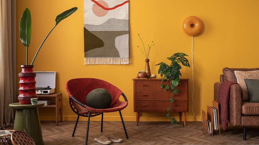 living room with yellow walls and red furniture