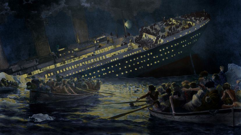 Lifeboats row away from the sinking Titanic in teh dark