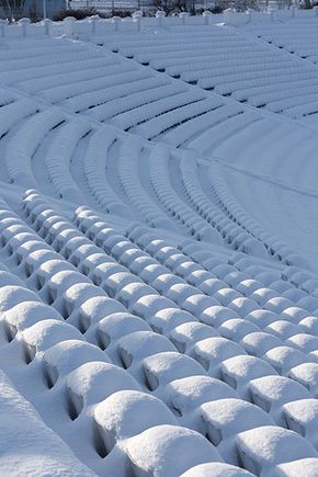 Thick layer of snow covering stadium seats
