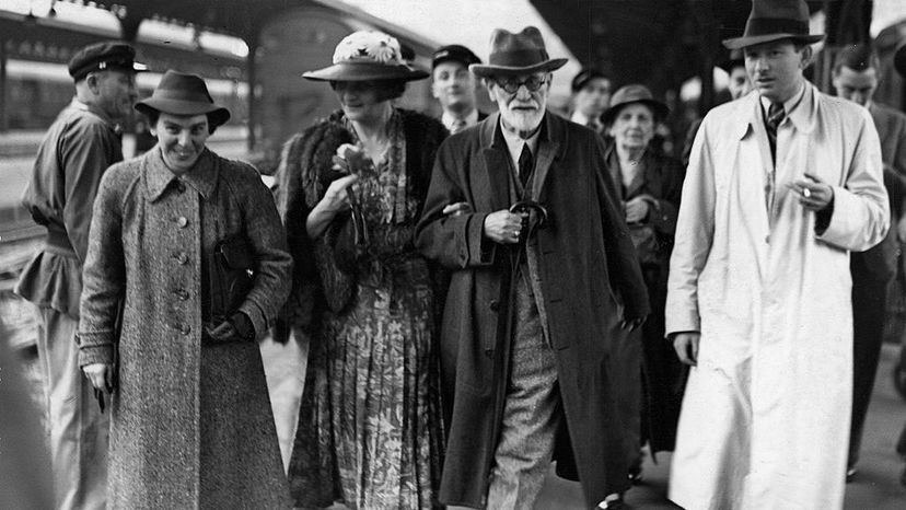Sigmund Freud (second right) arrives in Paris after leaving Vienna en route to London, June 1938. He is accompanied by his daughter Anna (left), Marie Bonaparte, the wife of Prince George of Greece (second left), and her son Prince Peter of Greece. Pictorial Parade/Getty Images