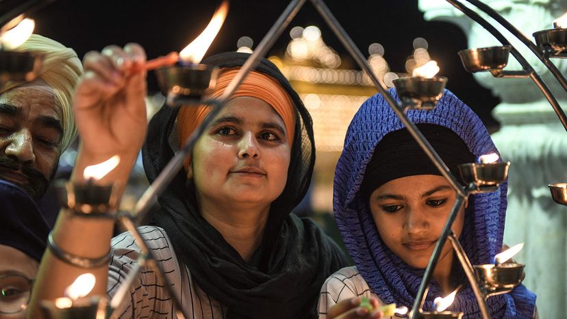 Sikhs light candles, India