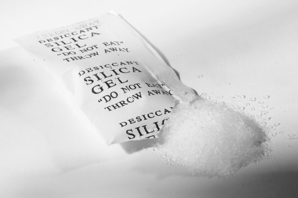 What is silica gel and why do I find little packets of it in