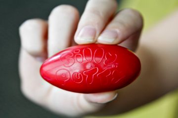 Person holding Silly Putty Egg