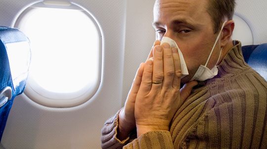 Why do sinus problems get worse during air travel?