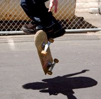 Boys having fun skateboarding outdoors.